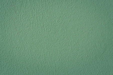 Fragment of a green plastered textured wall.の写真素材