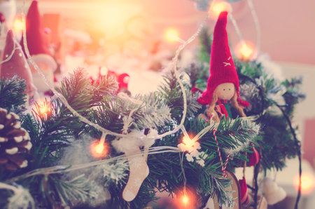 Merry Christmas and Happy New Year background. Winter season holiday decoration with decoration and garland lights.の写真素材
