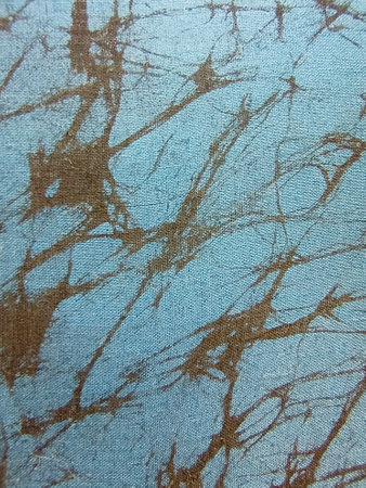 Abstract pattern on fabric texture. Fragment of canvas, close-up. Vertical photography.の写真素材