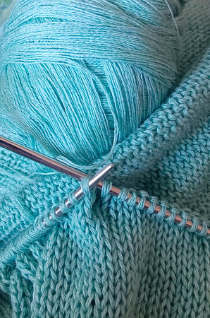 Blue knitting wool and knitting needles. Vertical photography.の写真素材