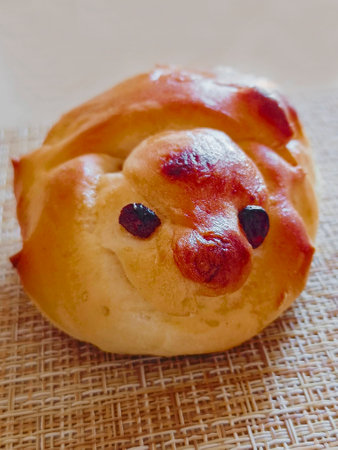 Home baked lark shaped bun. Holiday Lark Day. Close-up, vertical photograph.の写真素材