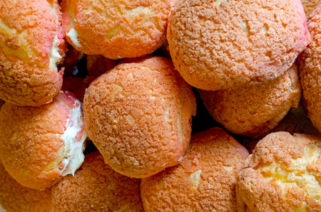 Homemade Mini Cream Puffs on a Plate, low angle view. Close-up.の写真素材