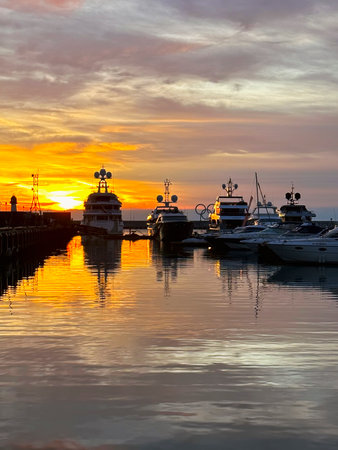 Beautiful sunset seascape, Sochi city, Russia. Bright sun, sunset. Atmospheric sky over the sea. Vertical photography.の写真素材