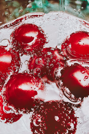 Close up shot of the Cherry in the water. Shot is good for commercialsの写真素材