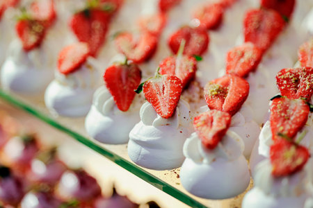 Tart cakes with protein cream, decorated with strawberries. Close-up, selective focus.の写真素材