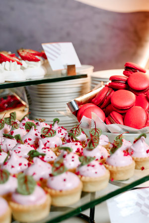 Cakes basket with protein cream, decorated with fruits and other various sweets in the restaurant. Close-up, selective focus, vertical photo.の写真素材