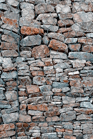 Gabion mesh and stones background wallpaper. vertical photo.の写真素材