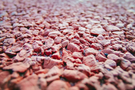 brown gravel pavement. stone covering paths, sidewalks. Close-up, selective focus.の写真素材