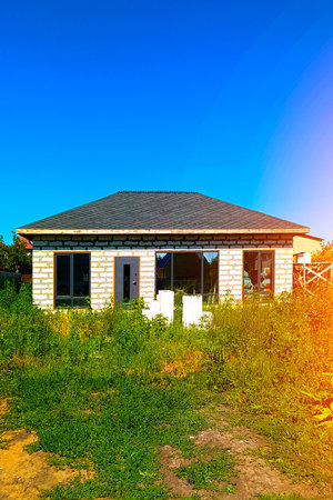 New one-story brick country house. Vertical photo.の写真素材