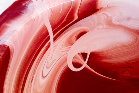 Abstract fluid art background burgundy colors. Liquid marble. Acrylic painting on canvas with burgundy gradient and splash.の写真素材