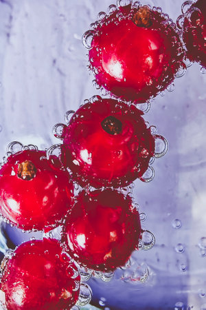 Ripe currents in mineral water. Close-up, selective focus.の写真素材