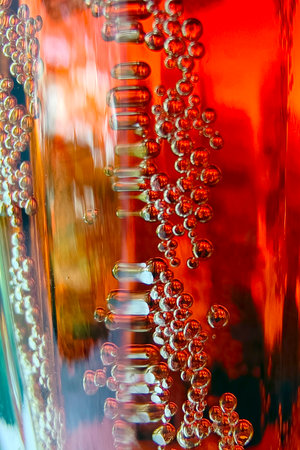 Processed collage of golden yellow drink bubbles texture. Background for banner, backdrop or texture.の写真素材