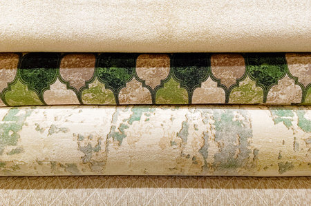 Different types of carpeting for sale in a store. Vertical photo.