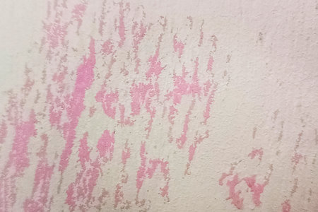 Abstract background of shabby concrete wall surface with paint and weathered partsの写真素材
