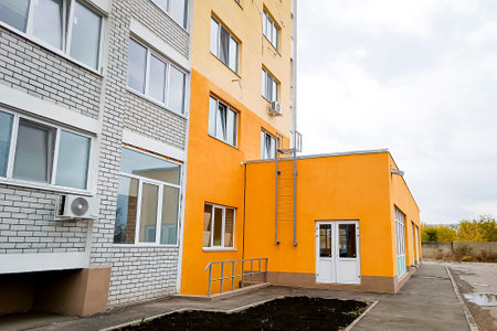 A new multi-storey brick residential building with an attached space for a store.の写真素材