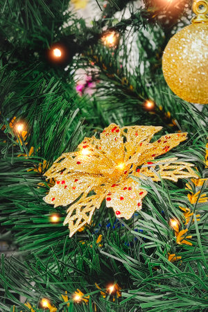 Christmas decorations on a tree. Close-up, vertical photo. Bokeh and lights, New Year's card.の写真素材