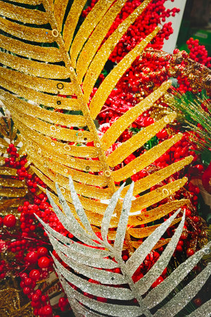 Gold and red Christmas tree decorations. Close-up, vertical photo.の写真素材