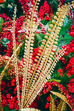 Gold and red Christmas tree decorations. Close-up, vertical photo.の写真素材
