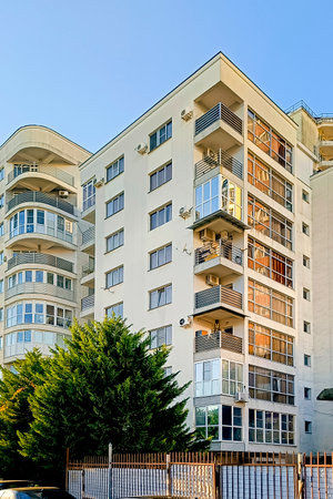 Modern multi-storey residential building with balconies. Vertical photo.の写真素材