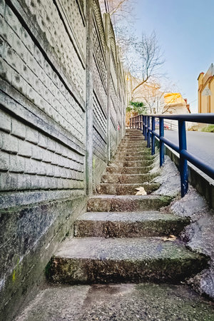 Old brick wall and stairs going up.