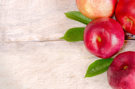 peaches on a white wood background. toning. selective focus on peach.の写真素材
