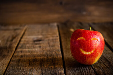 apple on a dark wood background. toning.の写真素材