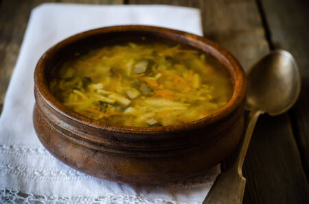mushroom soup on a dark woodの写真素材