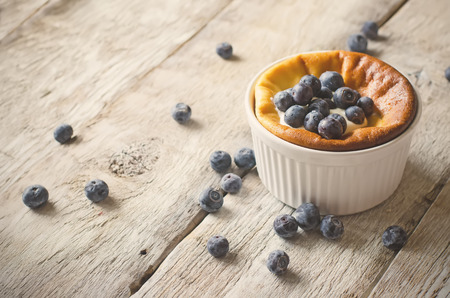 cottage cheese cake with blueberry on a wood background. toningの写真素材