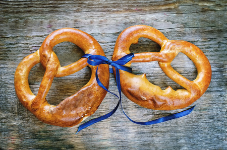 pretzels on a dark wood background. tinting. selective focus on the bowの写真素材