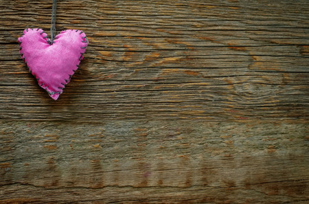 Valentine\'s day background with heart on a dark wood background.の写真素材