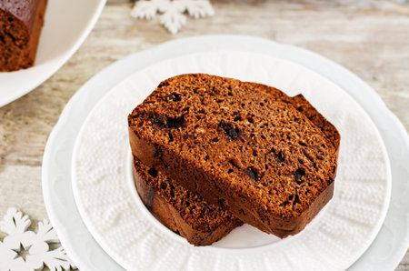 chocolate bread with chocolate chips on a white wood background. tinting. selective focus