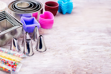 tools for baking on white wood background. tinting. selective focus