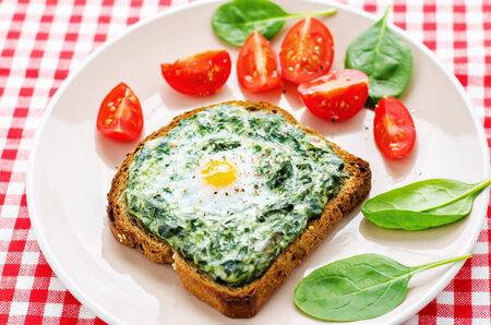 sandwich baked with spinach, cream cheese and egg. tinting. selective focusの写真素材