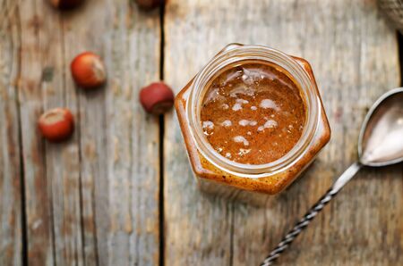 praline in a jar on a dark wood background. tinting. selective focusの写真素材