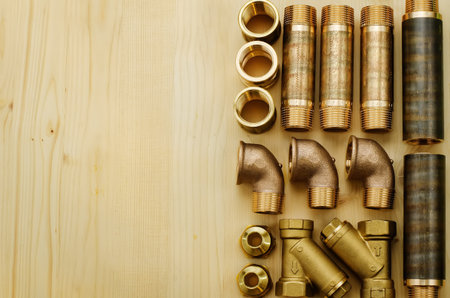 tools plumbing on a light woody background. tinting. selective focus