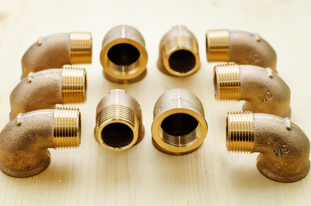 tools plumbing on a light woody backgroundの写真素材