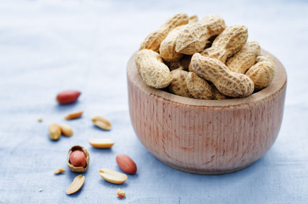 peanuts on a blue background. tinting. selective focus