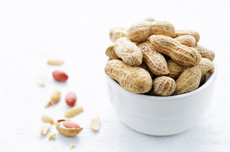 peanuts on a white background. tinting. selective focus