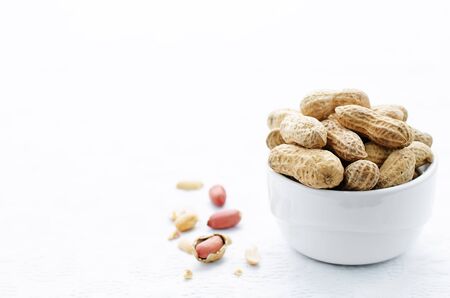 peanuts on a white background. tinting. selective focusの写真素材