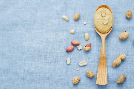 peanut butter on a blue background. tinting. selective focusの写真素材