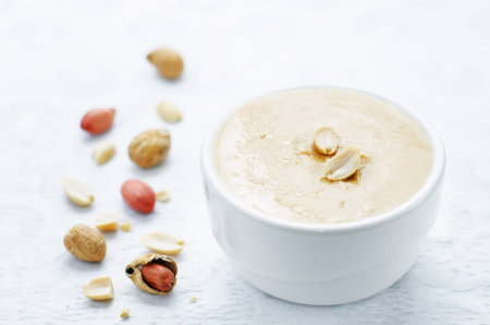 peanut butter on a white background. tinting. selective focus