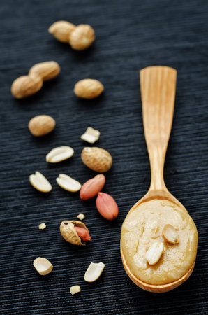 peanut butter on a black background. tinting. selective focus