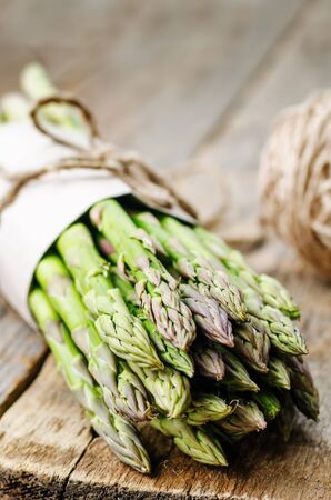 asparagus on a dark wood background. the toning. selective focusの写真素材