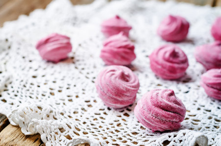 blackcurrant marshmallows, zephyr, in the dark wood background. the toning. selective focus