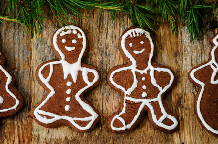 Christmas tree background with Christmas tree and gingerbread shaped cookies. the toning. selective...