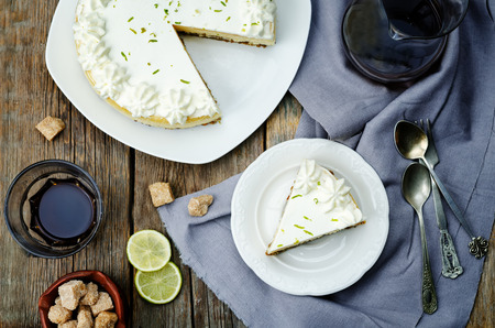 lime cheesecake on a dark wood background. toning. selective focusの写真素材