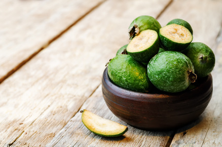 Feijoa on a white wood background.の写真素材