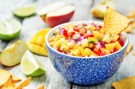 apple mango salsa on a white background wood. toning. selective Focusの写真素材