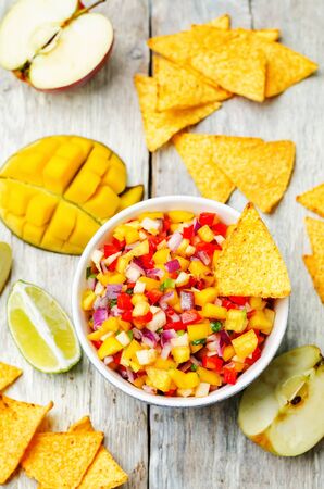 apple mango salsa on a white background wood. toning. selective Focusの写真素材