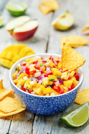 apple mango salsa on a white background wood. toning. selective Focusの写真素材